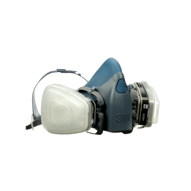 The 3M Professional Paint Spray Respirator Medium is a gray and blue reusable mask with dual white filters and adjustable straps, designed for respiratory protection in industrial and spray painting environments.